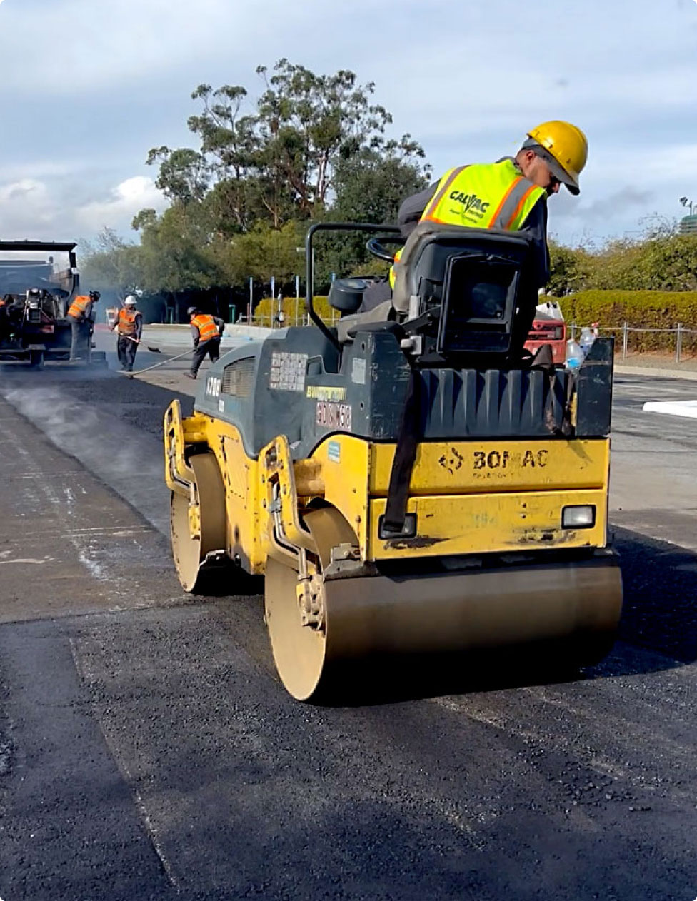 cavlac paving in San Jose concrete and asphalt worker on paver