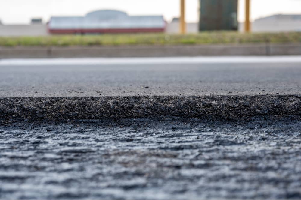 can asphalt be laid over concrete
